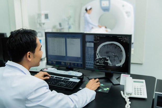 A doctor looking at a patient's brain scan.