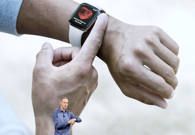 Apple executive giving a demo of the new Apple Watch.